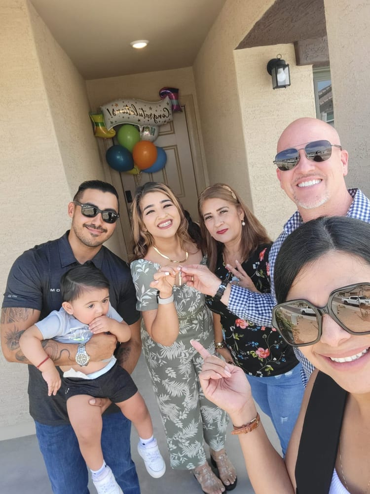 Bryan and Stephanie with their family at their new home