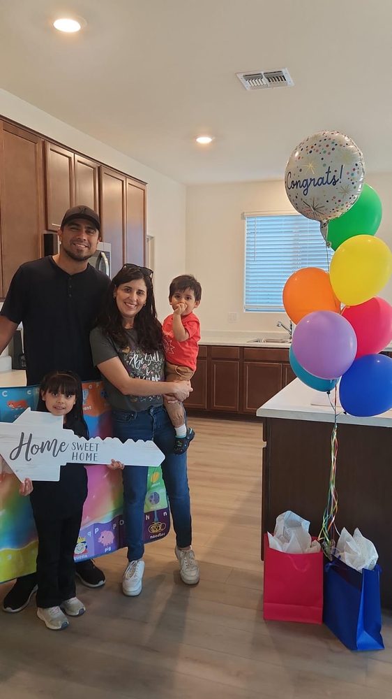 Josue and Anahi M. at their new home